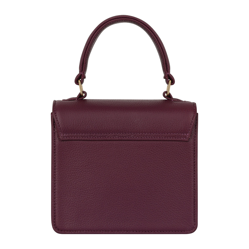 Luis Steven Madie burgundy pebble leather small top handle bag with gold hardware and lock closure.