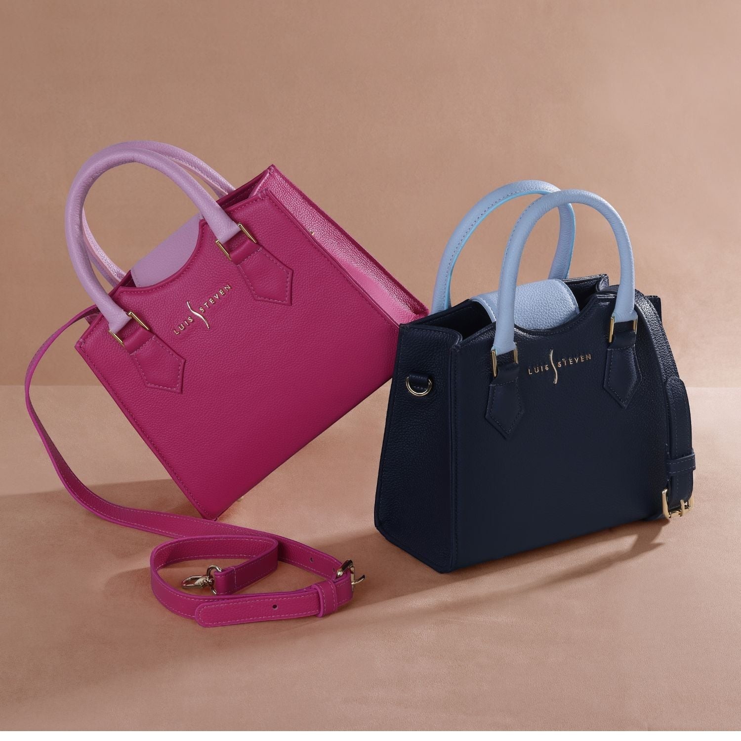 Luis Steven mini tote bag in navy blue and pink pebble leather with contrasting light blue handles. Detachable crossbody strap included.