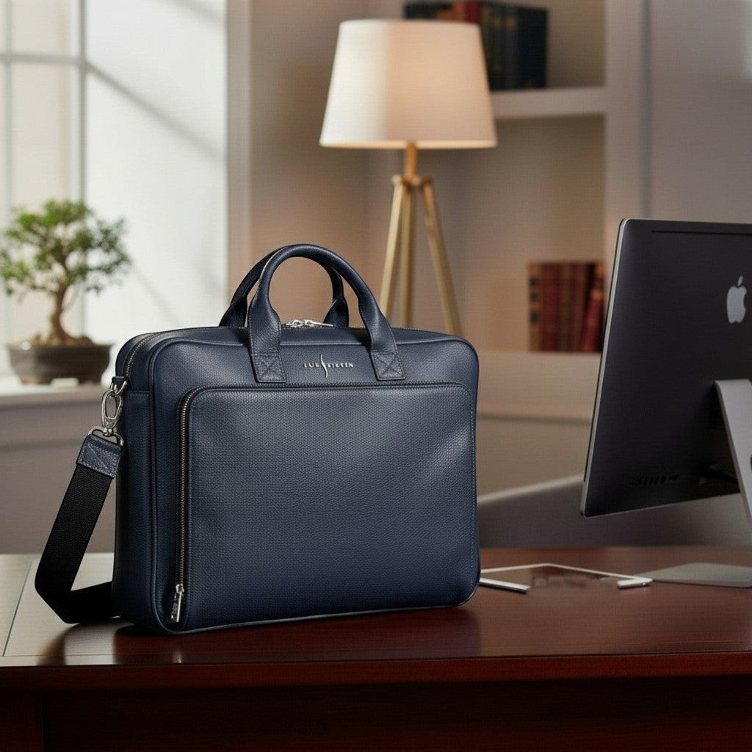 Luis Steven navy blue pebble leather briefcase with suede interior, top handle, and crossbody strap. Fits 15" laptops.