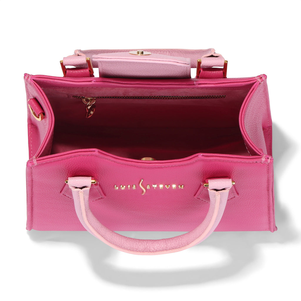 Luis Steven mini tote bag in pink pebble leather with dual top handles and a detachable crossbody strap. Features gold hardware and a magnetic closure.