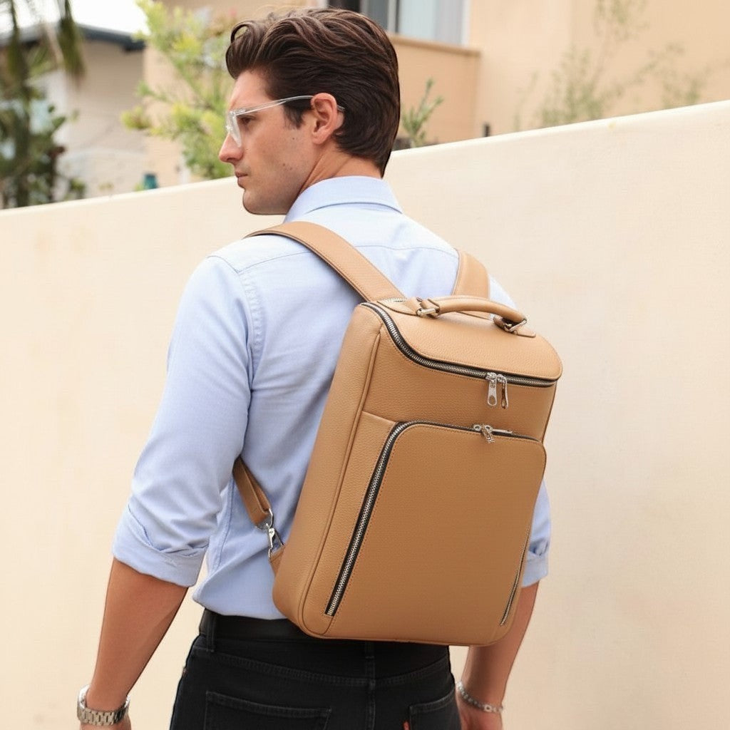 Luis Steven sand pebble Italian leather laptop backpack with concealable straps and multiple zip pockets.
