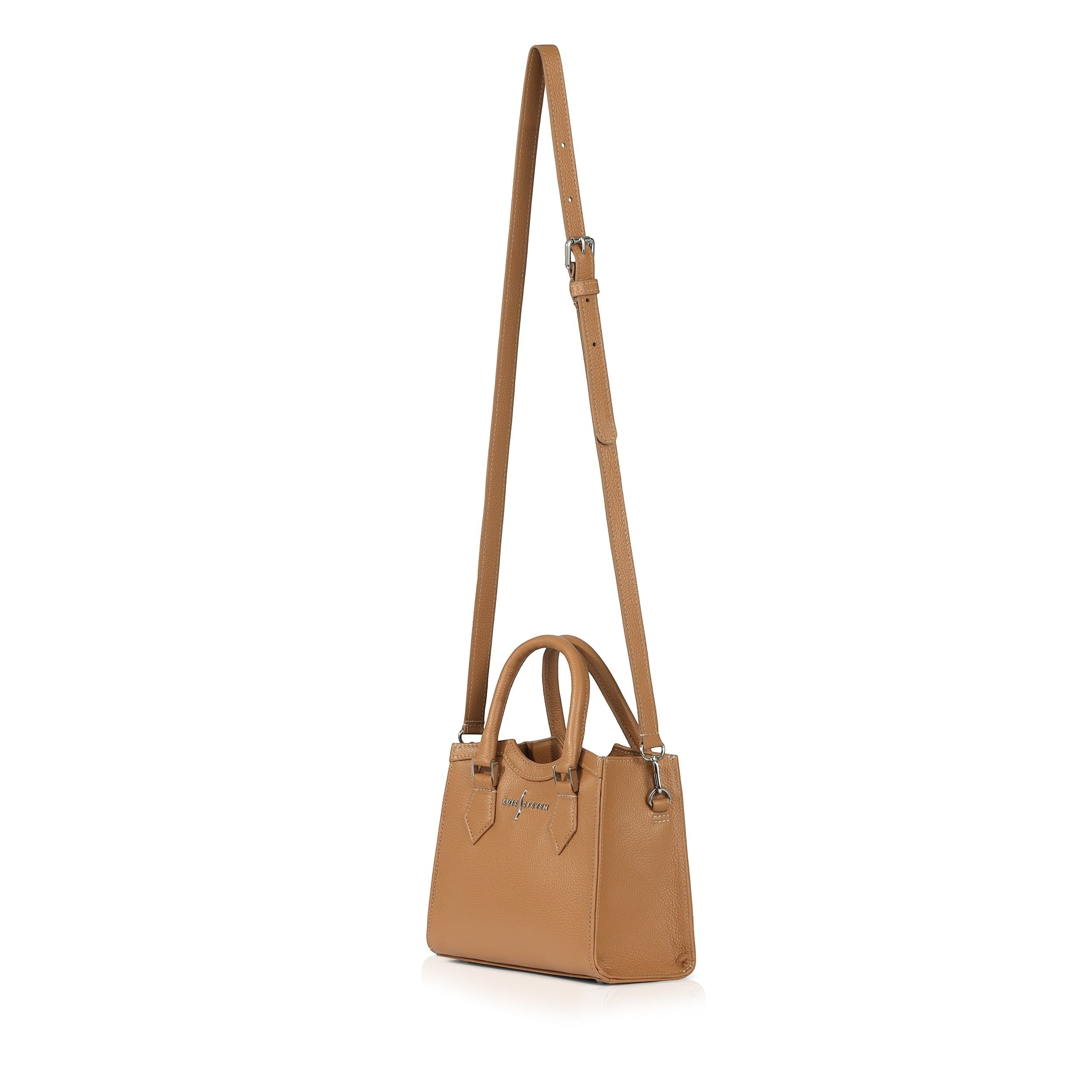Luis Steven tan pebble leather mini tote bag with top handles and an adjustable crossbody strap, side view.