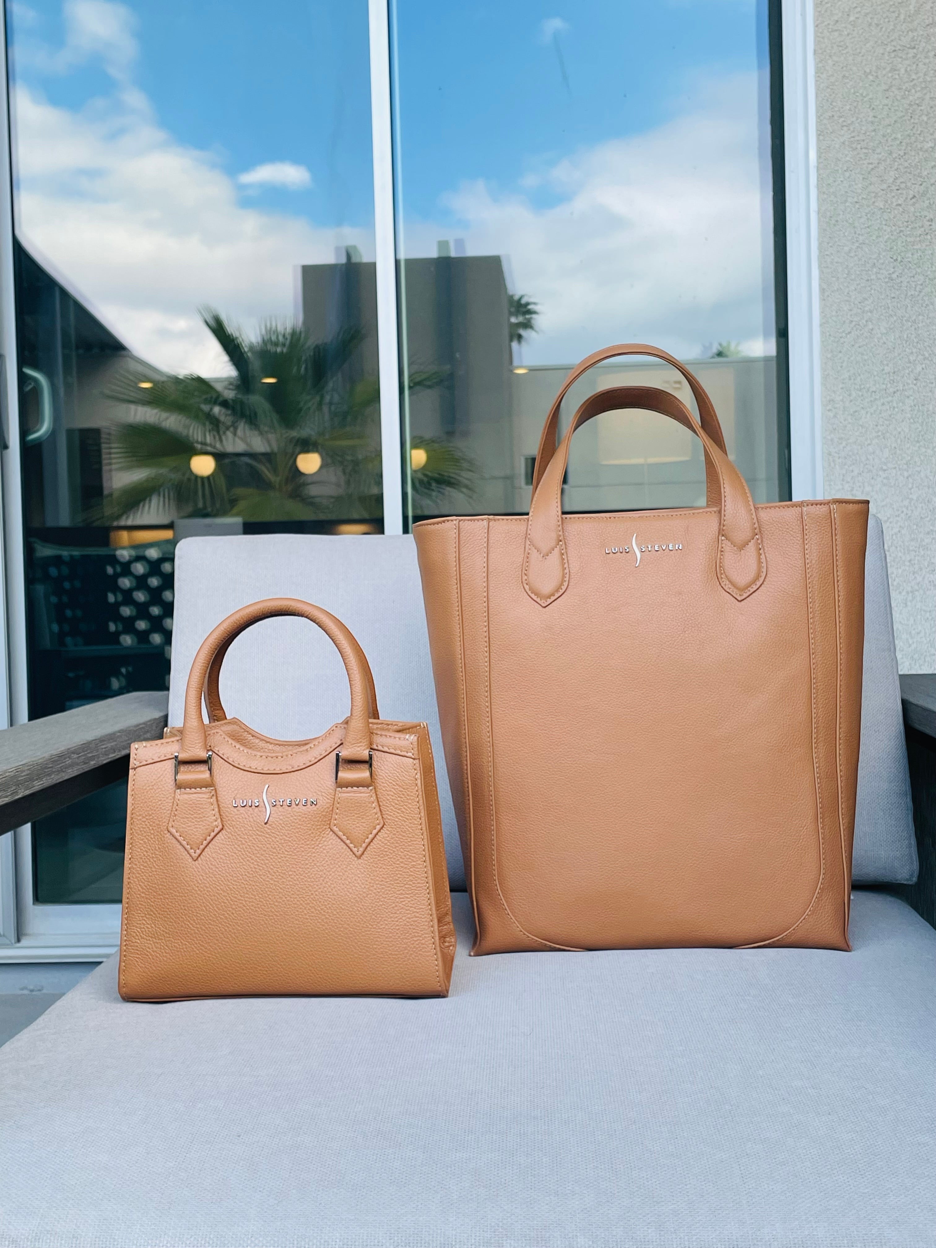 Luis Steven tan pebble leather mini and medium tote bags with top handles and nickel logo hardware on a patio chair